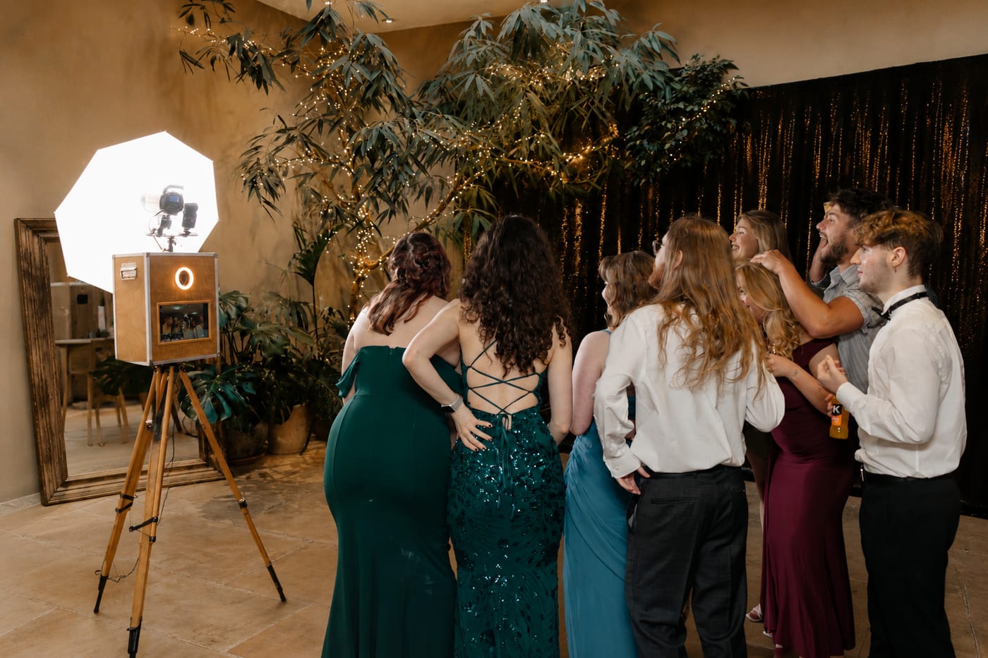 Wedding guests enjoying the UniMoments photo booth at an Exeter venue